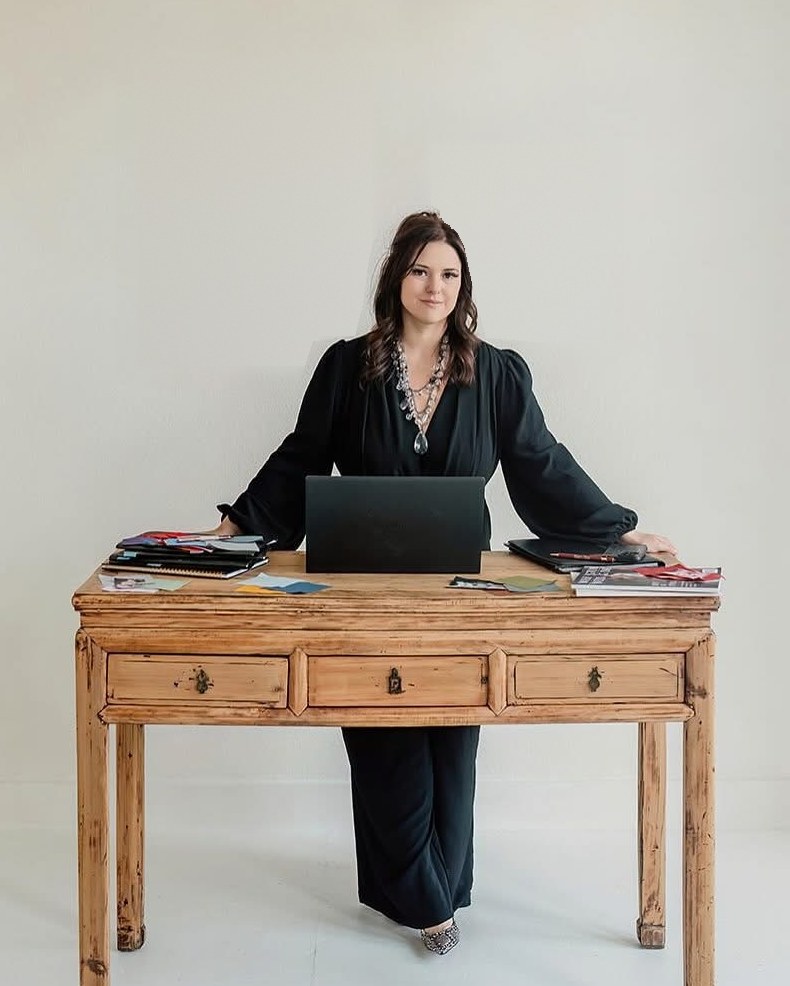 Bridget Cormier, COO and marketing specialist at Classic Cleanouts LLC, at her desk